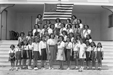 A troop of Japanese American Girl Scouts in an internment camp.