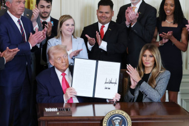 President Trump and First Lady Melania Trump with Administration members and foster-care advocates at a signing ceremony for the “Fostering the Future” executive order, on November 13th.Photograph by Anna Moneymaker / Getty