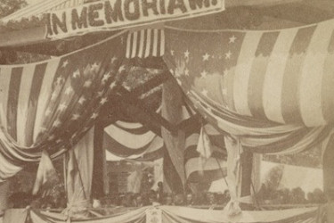 Decoration Day stage with flags and bunting.