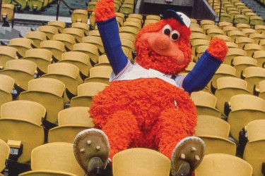 Youppi! mascot sitting in a baseball stadium