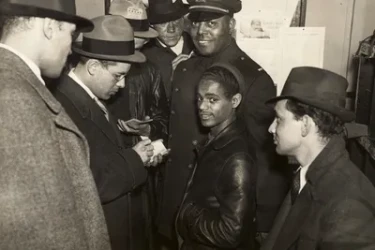 16-year-old Lino Rivera standing with police lieutenant Samuel J. Battle