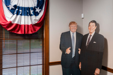 Cardboard cutouts of Donald Trump Ronald Reagan.