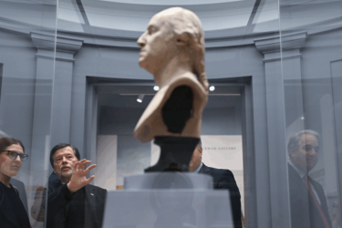 Directors Sarah Botstein and Ken Burns look at a bust of George Washington