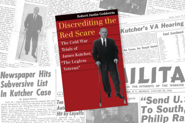 Newspapers in the background with "Discrediting the Red Scare" book on top.