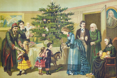Family gathering around a christamas tree wearing fancy clothing.