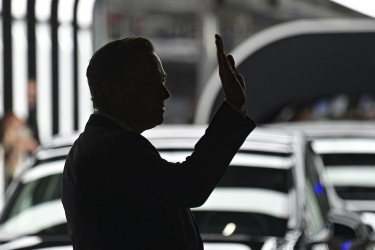 Elon Musk waving.