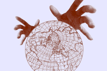 A pair of hands reaches to grab a globe.