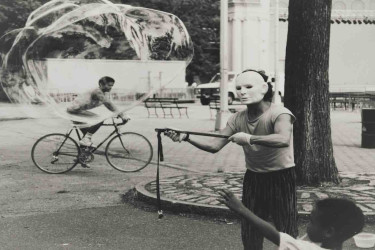 Shawn Walker’s "Man with Bubble, Central Park," a surrealist photograph.