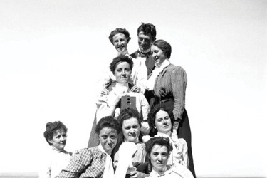 Friends and family of Theresa P. Babb in a group photo by the shore in 1900.