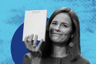 Amy Coney Barrett holding a senate report.