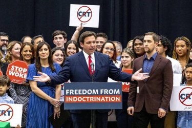 Florida governor Ron DeSantis signs the “Stop WOKE Act” bill in April 2022.