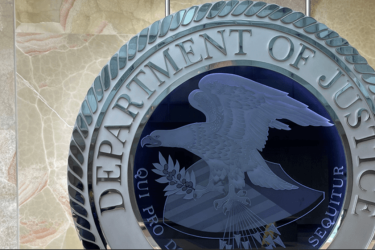 Department of Justice logo on a wall.