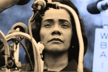Coretta Scott King standing in front of many microphones.