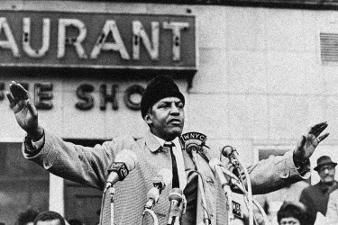Bayard Rustin speaking in front of a crowd