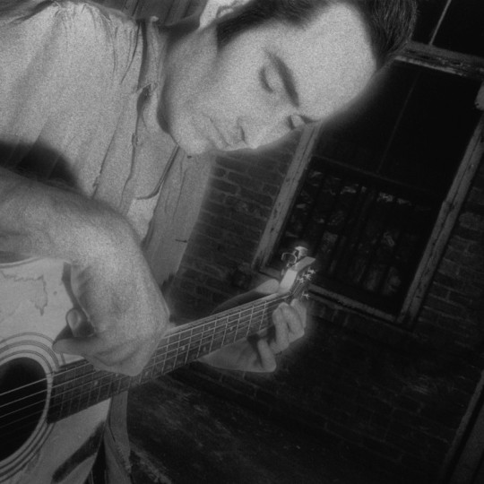 Michael Knott playing guitar