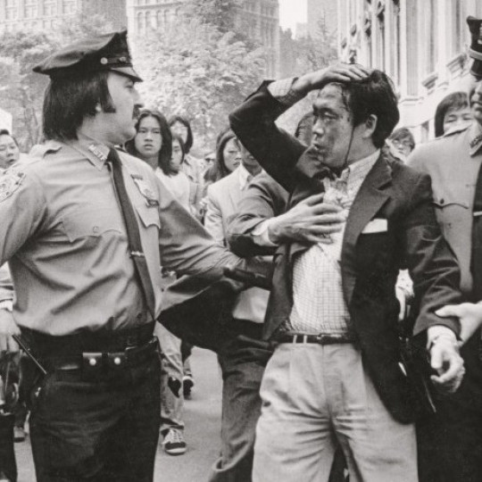 1975 shot of a victim of police brutality. Photo by Corky Lee.