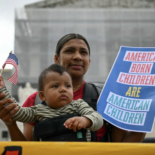 A mother and son at a protest outside of the U.S. Supreme Court.