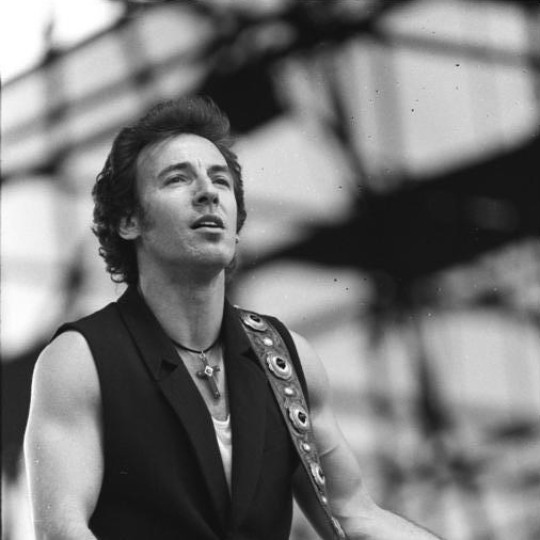 Bruce Springsteen playing the guitar.
