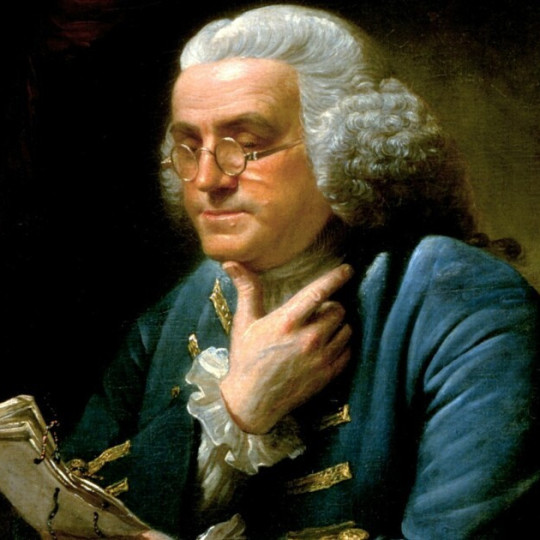 Portrait of Benjamin Franklin reading.