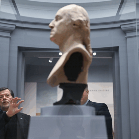 Directors Sarah Botstein and Ken Burns look at a bust of George Washington