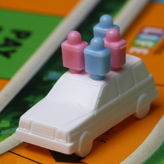 Plastic car on the board game 
