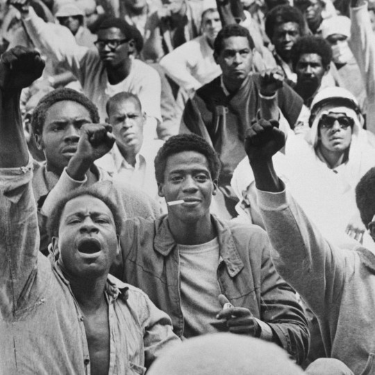 Prisoners at the Attica Correctional Facility give the Black Power salute on September 10, 1971.