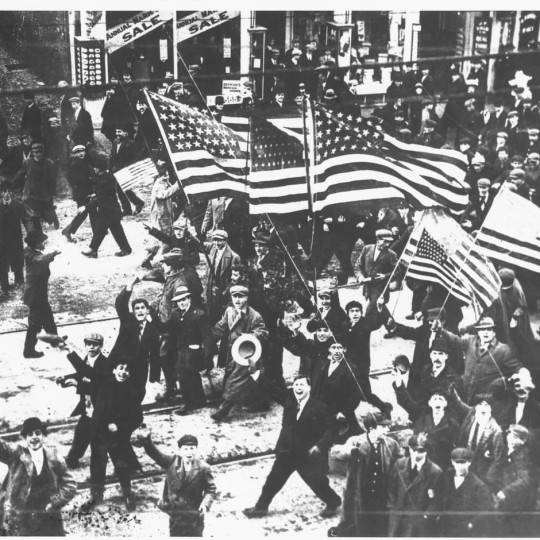 The working-class carrying American flag cheering for joy
