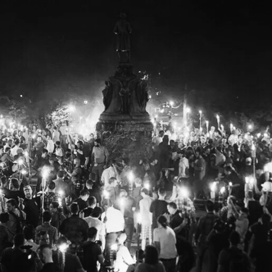 Unite the Right rally gathers with torches around Robert E. Lee statue in Charlottesville in 2017.