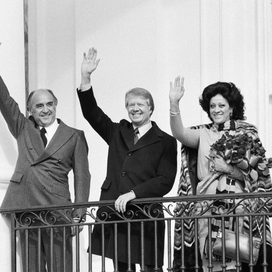U.S. President Jimmy Carter waving with Mexican President Jose López Portillo and their wives in 1977.