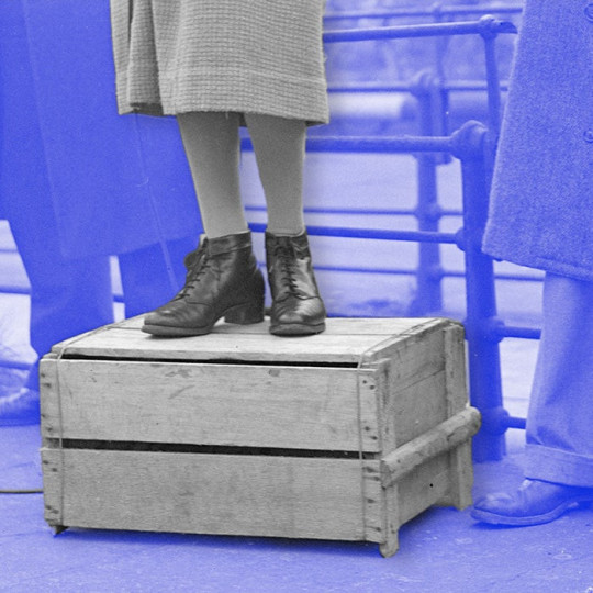 Illustration from a woman standing on a soapbox speaking into a microphone, 1944 Getty/JSTOR Daily
