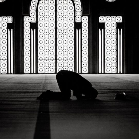 A Muslim prays inside a mosque.