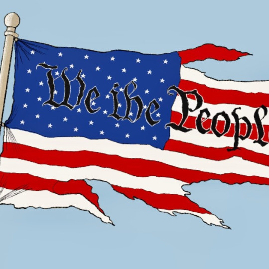 We The People written on a tattered American flag.