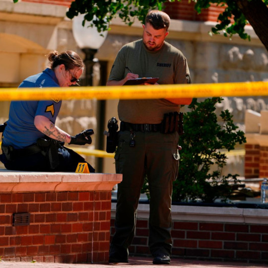 Sheriff’s deputies investigate a shooting scene outside the Montgomery County Courthouse, May 13, 2026, in Clarksville, Tennessee.