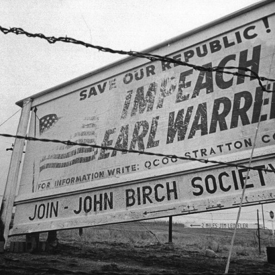 A John Birch Society sign calling for the impeachment of Earl Warren.