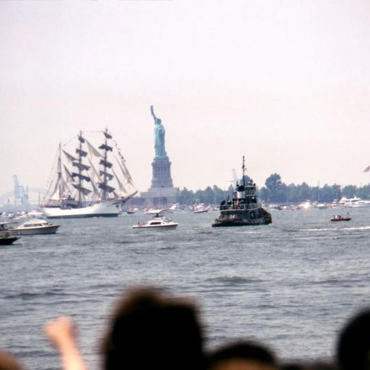 Spectators watch Operation Sail, a parade of 16 majestic tall ships from 14 nations to celebrate the U.S. bicentennial, in New York Harbor on July 4, 1976.