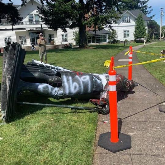 Toppled George Washington statue spray painted with 