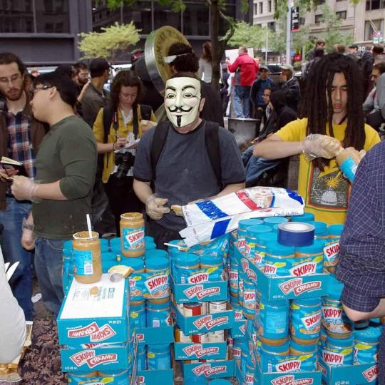 Occupy movement activists making peanut butter sandwiches.
