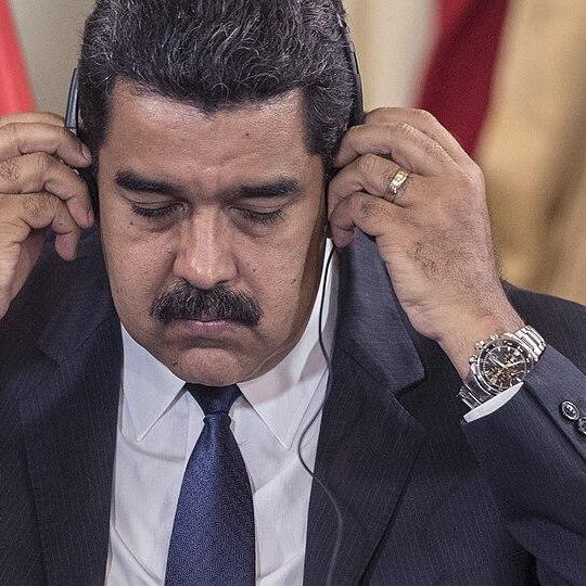 Maduro listening to headphones