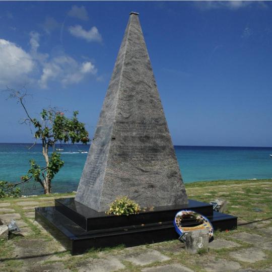 Stone pyramid monument to Cubano Flight 455 stands by the water in Barbados