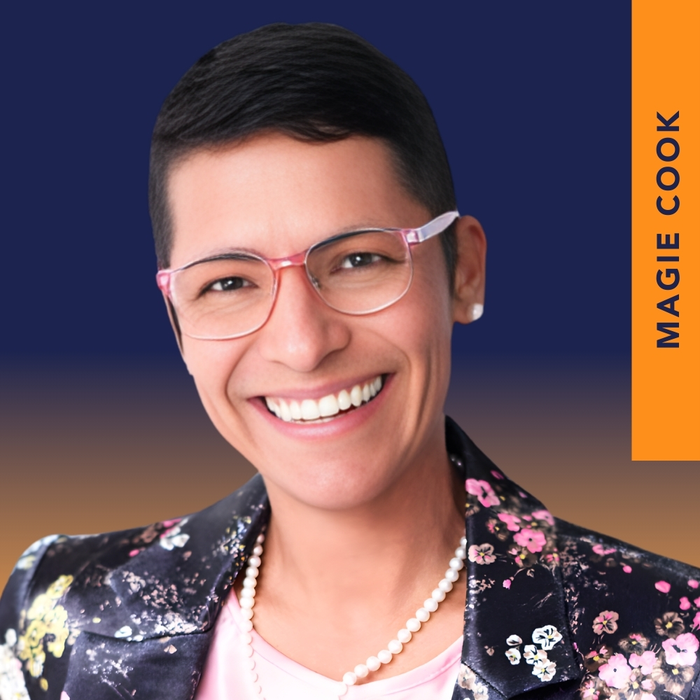 Smiling person with short dark hair, wearing glasses, a floral blazer, and pearl necklace. Text on the right reads "MAGIE COOK" on an orange vertical banner.