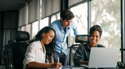 Group of busy happy diverse professional business team people working in office using digital tablet. Multiethnic young startup team working on a project together