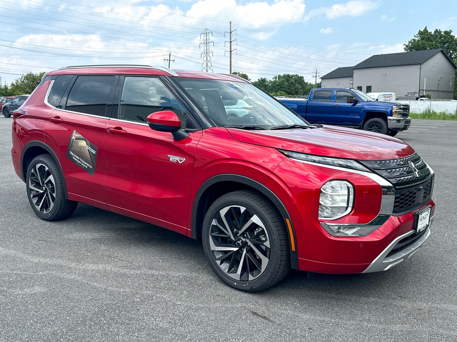 Photo view of 2025 Mitsubishi Outlander PHEV in Red