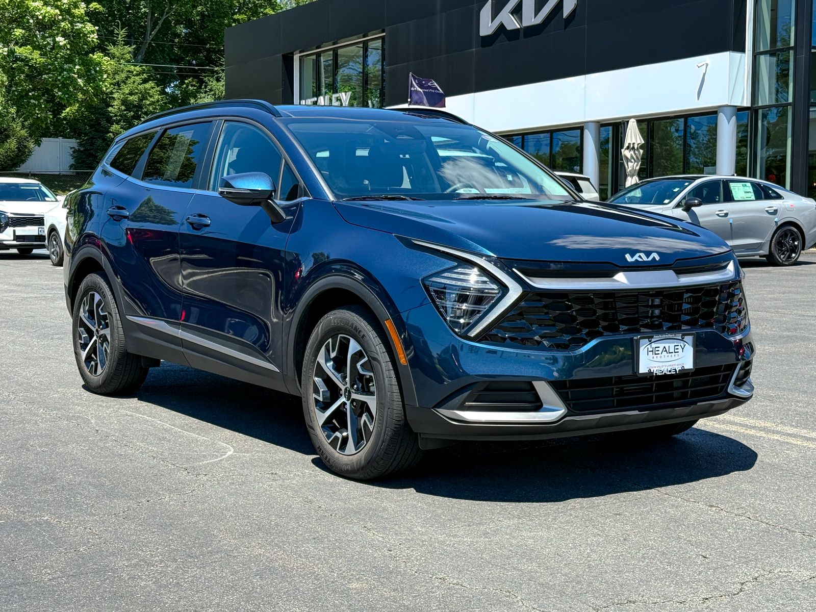 Photo view of 2025 Kia Sportage Hybrid in Blue
