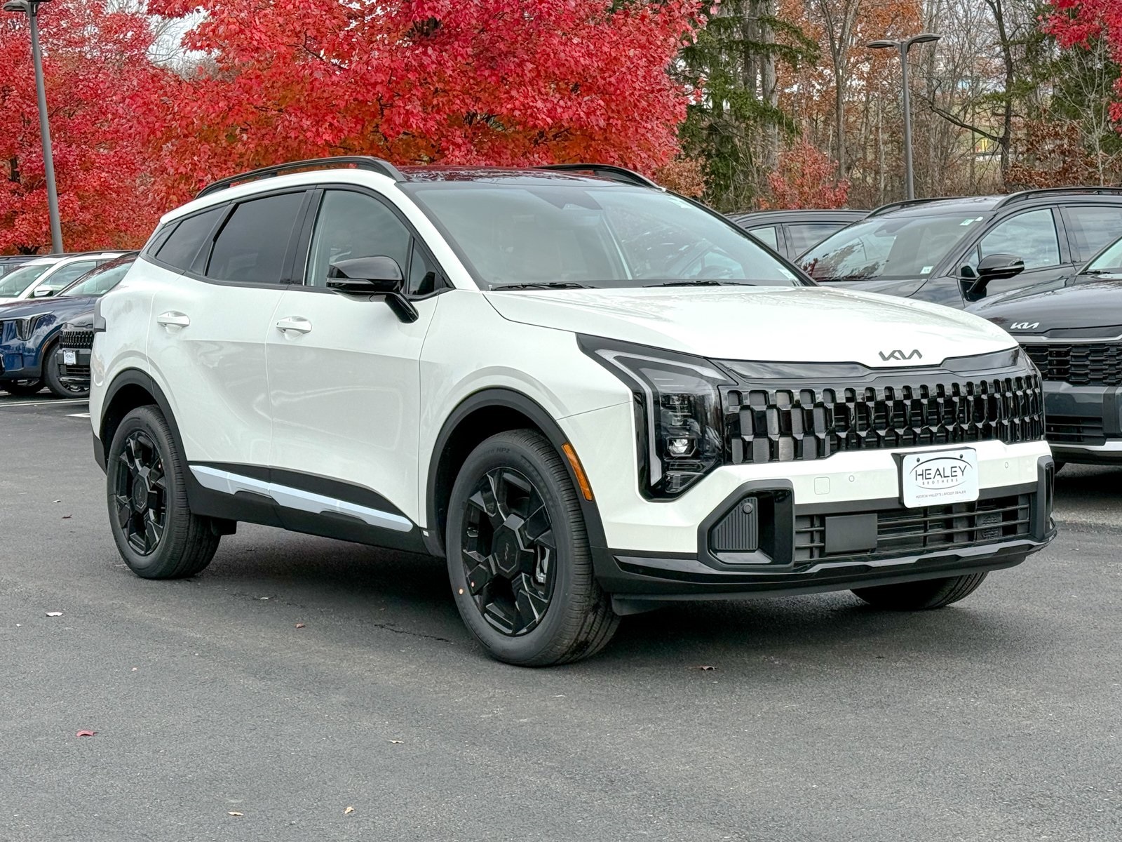 Photo view of 2026 Kia Sportage Hybrid in White