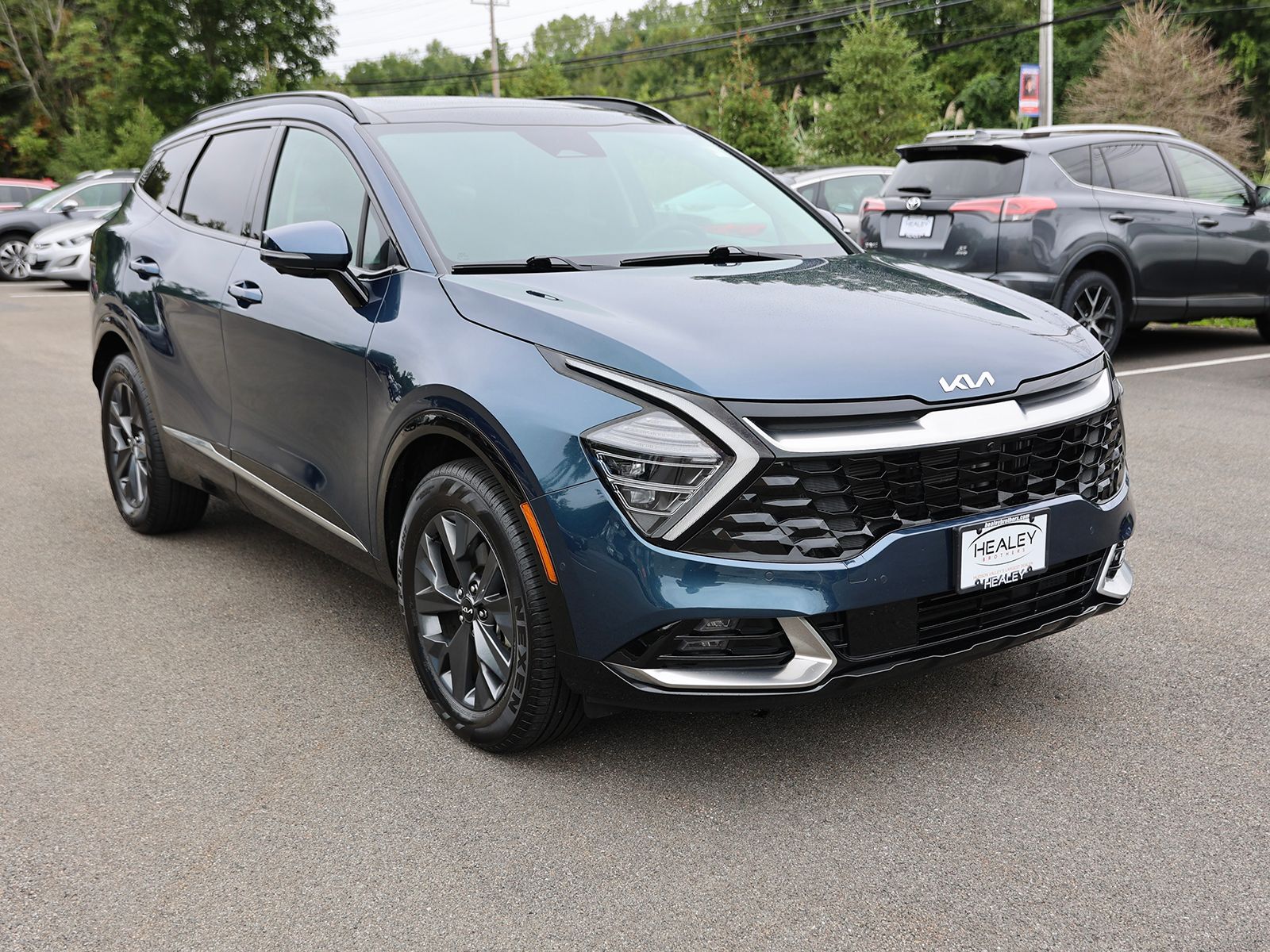 Photo view of 2024 Kia Sportage Hybrid in Blue