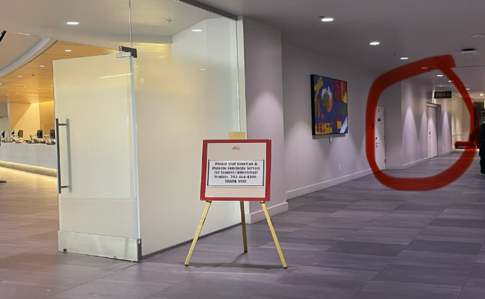 A sign in a hallway 
Description automatically generated with medium confidence