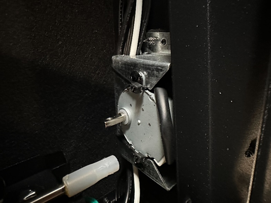 2 screws holding flame motor in place
