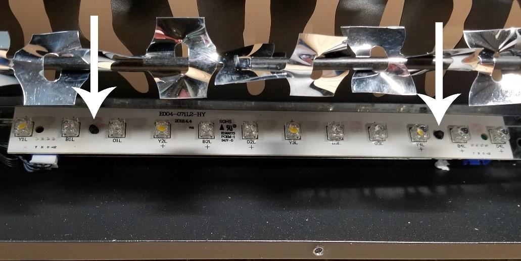 Clips holding LED light strip in place