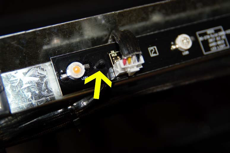 Arrow pointing to standoff holding ember bed LED light strip