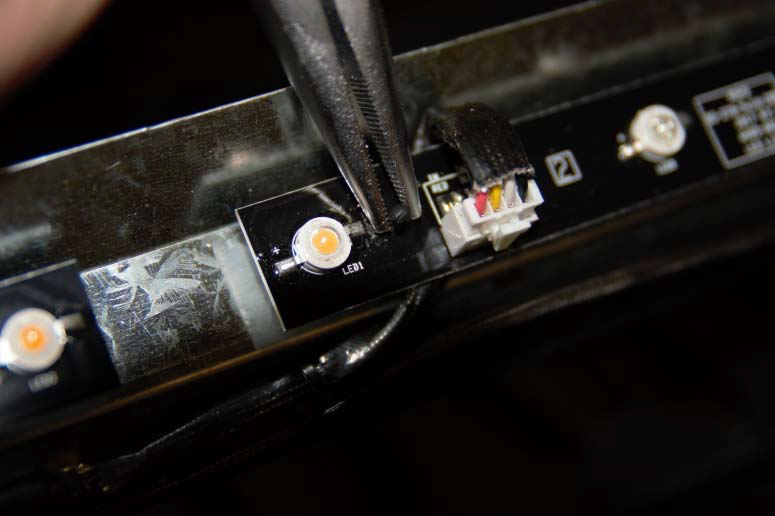 Using needlenose plyers to pinch ember bed LED light strip